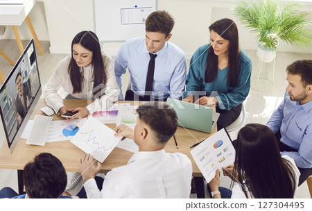 Business team having a conference call with their manager during a work meeting in the office 127304495