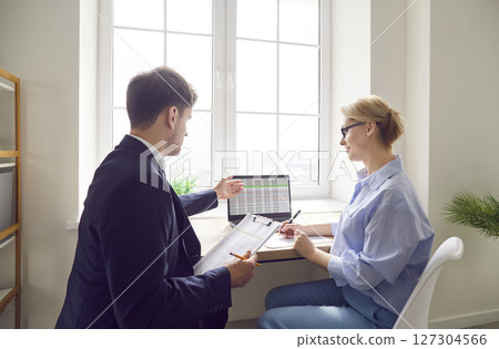 Colleagues Working Together on Business Accounting 127304566