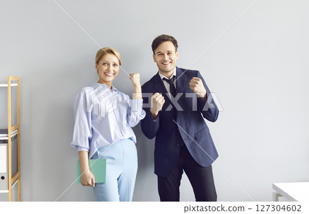 Happy Business Colleagues Celebrating Success In Office Happy Business Colleagues Celebrating Success In Office 127304602