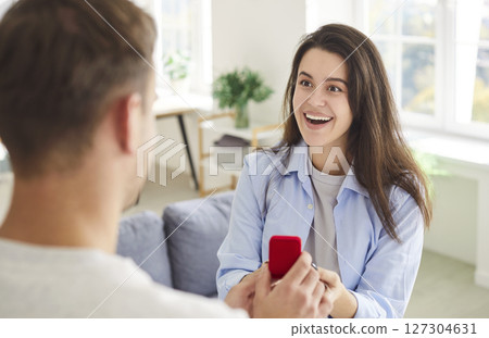 Man Proposing With Ring To Woman In Romantic Moment 127304631