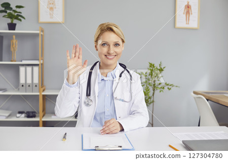 Doctor Or Nurse Waving During Online Video Call From Hospital 127304780
