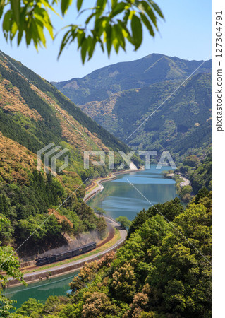 A view of the former Hisatsu Line steam locomotive running along the Kuma River from Kumamura Forest Road A view of the former Hisatsu Line steam locomotive running along the Kuma River from Kumamura Forest Road 127304791