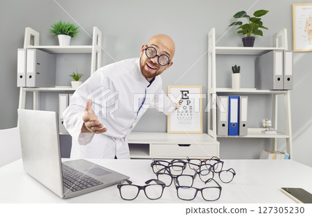 Funny Ophthalmologist Conducting Eye Examination In Office Funny Ophthalmologist Conducting Eye Examination In Office 127305230