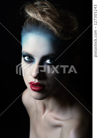 Beautiful woman with fancy make-up close-up studio portrait 127305243