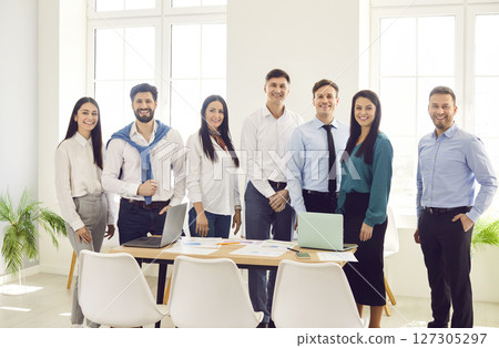 Professional group leader and corporate staff, smiling young people, successful work group office Professional group leader and corporate staff, smiling young people, successful work group office 127305297