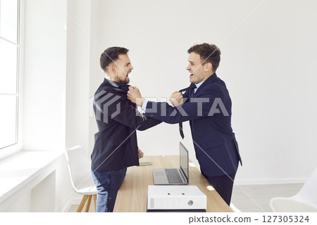 Angry business people colleagues disputing having disagreement fighting at workplace 127305324