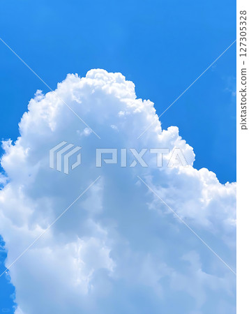 Cumulus Cloud Formation Against a Vibrant Blue Sky Summer Day. Cumulus Cloud Formation Against a Vibrant Blue Sky Summer Day. 127305328