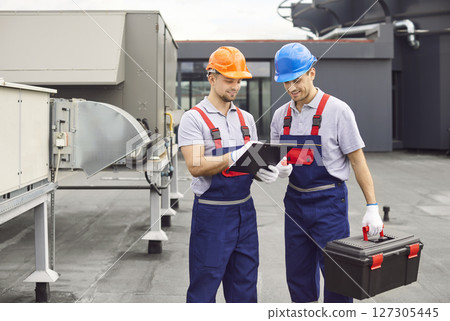 Repairmen Conducting Maintenance And Inspection Of Hvac And Ventilation System 127305445