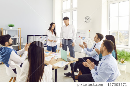 Team Of Business People Holding A Group Meeting In The Office 127305571