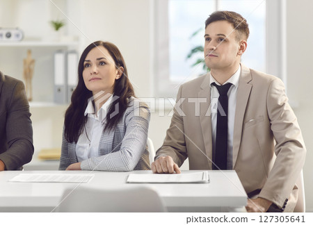 Colleagues Engaged In A Productive Office Meeting Or Conference Colleagues Engaged In A Productive Office Meeting Or Conference 127305641