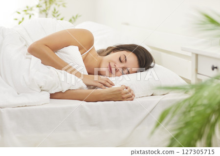 Happy Woman Sleeping Or Napping On Bed At Home In The Early Morning Happy Woman Sleeping Or Napping On Bed At Home In The Early Morning 127305715