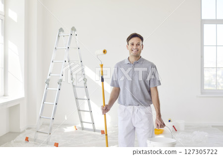 Smiling Painter At Work During Home Renovation 127305722