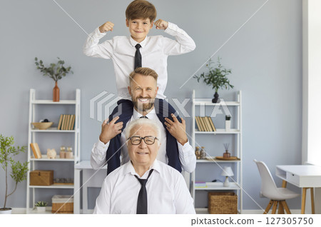 Happy funny family of three generation men, grandfather, father, son, cute child grandson playing  127305750