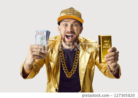 Funny and extravagant rich happy man in shining golden jacket, massive chain around neck with money Funny and extravagant rich happy man in shining golden jacket, massive chain around neck with money 127305820