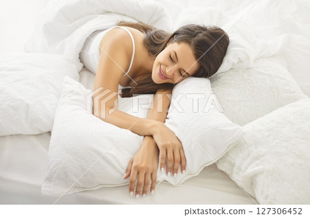 Happy Woman Relaxing On The Bed In The Morning At Home 127306452