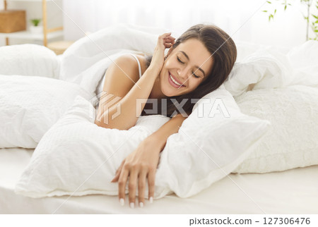 Portrait Of A Relaxed Woman Lying In Bed At Home During Leisure Time Portrait Of A Relaxed Woman Lying In Bed At Home During Leisure Time 127306476