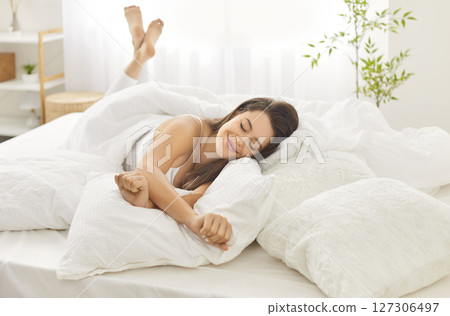 Happy Woman Relaxing In Bed In The Early Morning 127306497