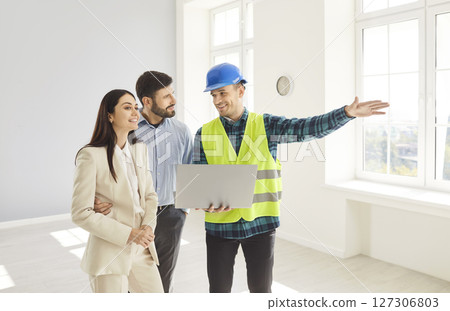 Builder Discussing Home Renovation Project With Husband And Wife Builder Discussing Home Renovation Project With Husband And Wife 127306803