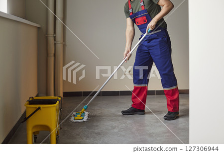 Janitor floor mop washing, janitorial worker cleaning service industry, professional cleaning Janitor floor mop washing, janitorial worker cleaning service industry, professional cleaning 127306944