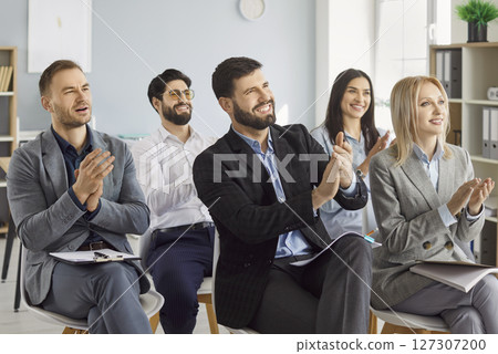 Happy friendly diverse employees applauding congratulating with business achievement, great work Happy friendly diverse employees applauding congratulating with business achievement, great work 127307200
