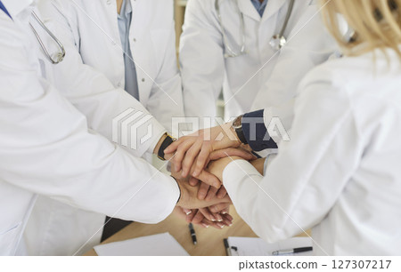Medical doctor team staff common high five together, corporate clinic workers join hands in success 127307217