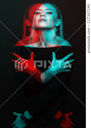 Beautiful woman with black dress studio portrait in RGB color split effect style Beautiful woman with black dress studio portrait in RGB color split effect style 127307240