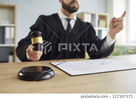Gavel wooden hammer bangs, judge sentences in court of law, accuses guilty, proclamation, judgement 127307373