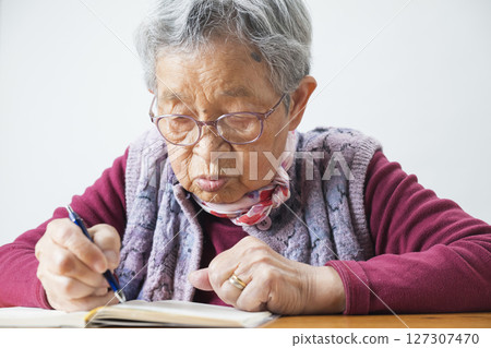 An 89-year-old grandmother writing a diary 127307470