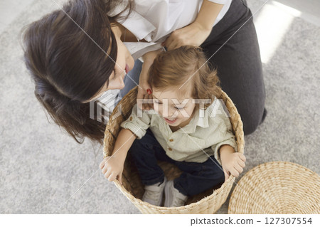 Playful funny active family, mother parent, babysitter, cute small child son playing together 127307554