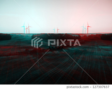 Aerial drone panoramic shot of windmills farm during summer sunset time in RGB color split effect 127307637