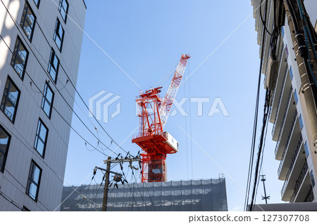 Crane at building construction site Crane at building construction site 127307708