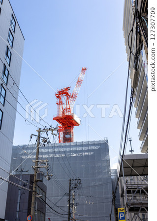 Crane at building construction site Crane at building construction site 127307709
