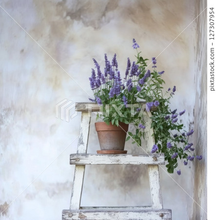 Rustic flowerpot with spring flowers showcasing cottagecore aesthetic in a charming farmhouse setting 127307954