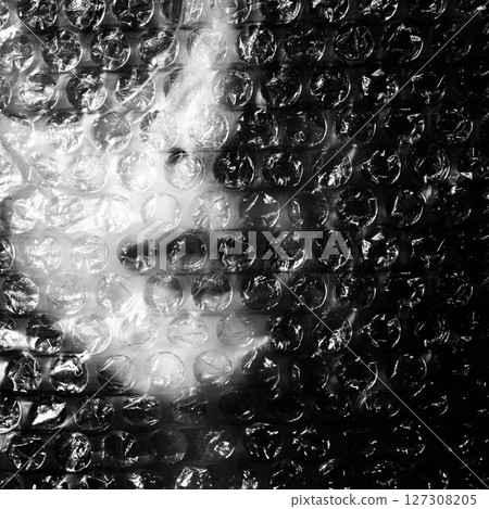 Abstract woman portrait through plastic bubble wrap Abstract woman portrait through plastic bubble wrap 127308205