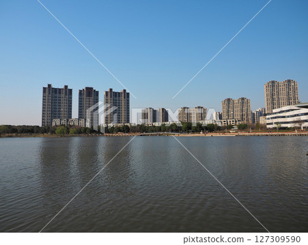 High-rise apartment buildings on the lakeside in Shanghai, China High-rise apartment buildings on the lakeside in Shanghai, China 127309590