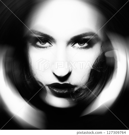 Close-up black and white woman portrait in radial blur effect style Close-up black and white woman portrait in radial blur effect style 127309764