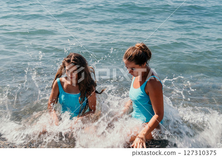 Two Women Enjoying the Ocean 127310375