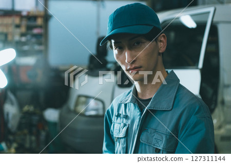 Young auto mechanic Young auto mechanic 127311144