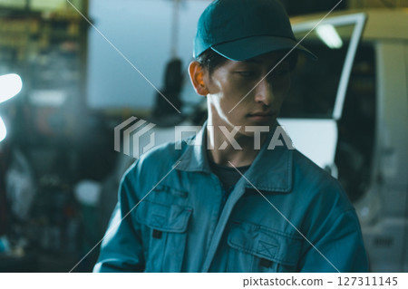 Young auto mechanic Young auto mechanic 127311145