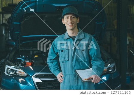 Young auto mechanic Young auto mechanic 127311165