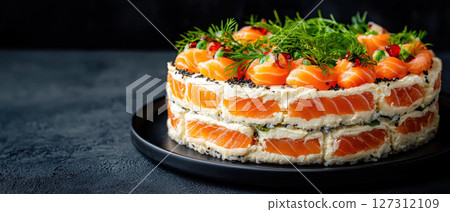 beautifully arranged sushi cake with layers of salmon, cream cheese, and herbs, perfect for celebrations 127312109