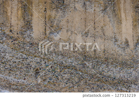 Abstract weathered concrete wall texture with visible aggregate. Abstract weathered concrete wall texture with visible aggregate. 127313219