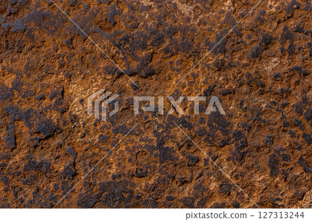Close-up of rough textured rusted iron surface Close-up of rough textured rusted iron surface 127313244