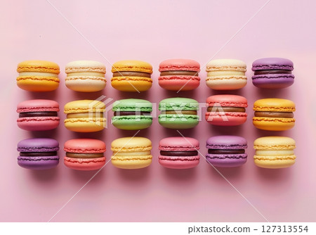 Vibrant Assorted French Macarons Arranged in Colorful Rows on Pastel Pink Background, Gourmet Dessert Selection for Bakery, Patisserie, Cafe, and Confectionery Concepts Vibrant Assorted French Macarons Arranged in Colorful Rows on Pastel Pink Background, Gourmet Dessert Selection for Bakery, Patisserie, Cafe, and Confectionery Concepts 127313554