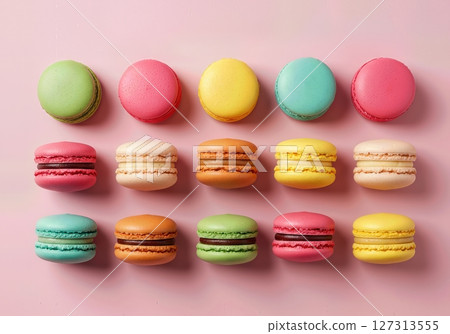Vibrant Assorted French Macarons Arranged in Colorful Rows on Pastel Pink Background, Gourmet Dessert Selection for Bakery, Patisserie, Cafe, and Confectionery Concepts Vibrant Assorted French Macarons Arranged in Colorful Rows on Pastel Pink Background, Gourmet Dessert Selection for Bakery, Patisserie, Cafe, and Confectionery Concepts 127313555