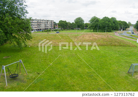 Grass football field playground aerial drone view from empty soccer field. 127313762