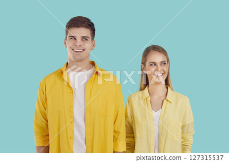 Young attractive Caucasian man and woman dream of happy future together, smiling look up coming up 127315537