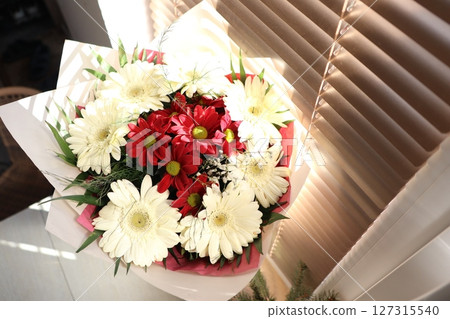 A Beautiful Bouquet of Red and White Flowers, Perfect for Any Occasion or Celebration 127315540