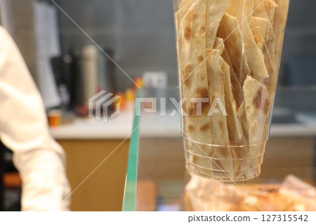 Cup of Crispy Snack Strips on Display in a Modern Caf 127315542