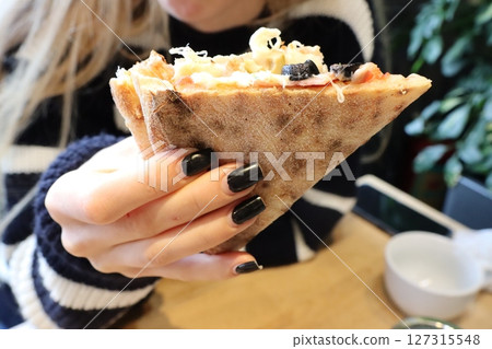 Delicious and Tasty Flatbread with Various Toppings Served in a Cozy and Inviting Setting Delicious and Tasty Flatbread with Various Toppings Served in a Cozy and Inviting Setting 127315548